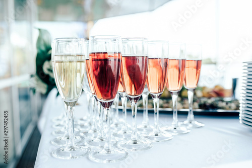 Glasses of white and pink wine on the table