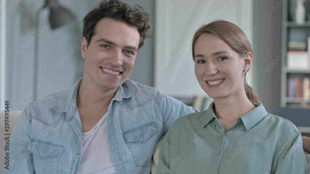 Portrait of Happy Couple Smiling at Each Other and Looking at the Camera Portrait of Happy Couple Smiling at Each Other and Looking at the Camera