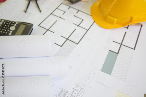 Desk of Architectural working project in construction site,With drawing equipment concept.