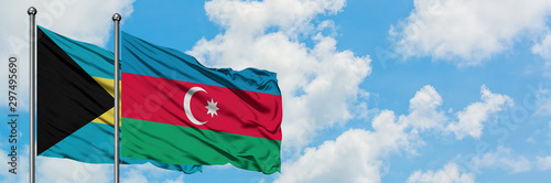 Bahamas and Azerbaijan flag waving in the wind against white cloudy blue sky together. Diplomacy concept, international relations.