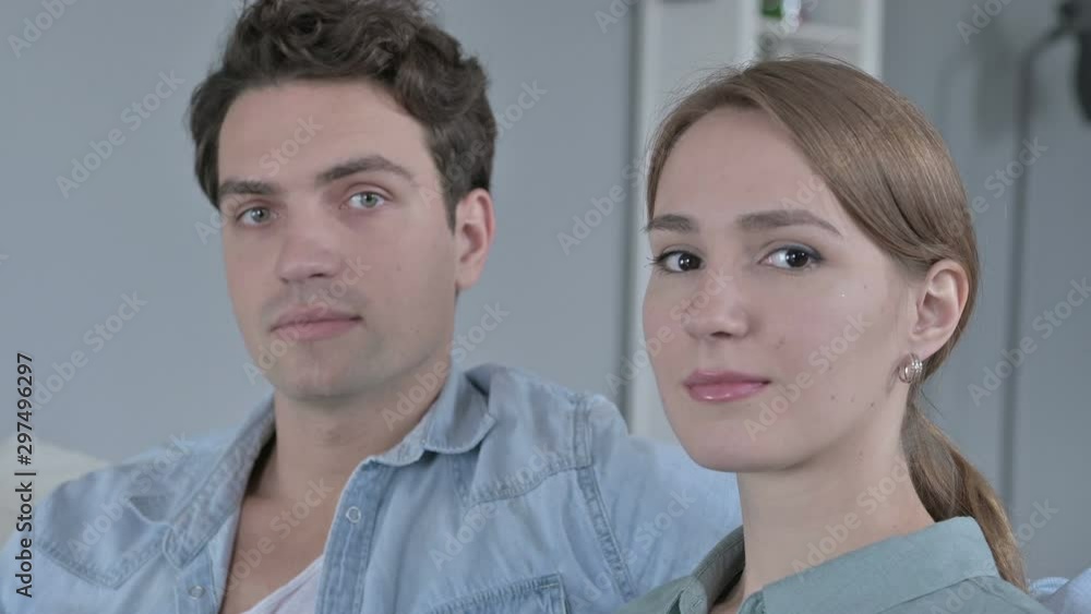 Portrait of Attractive Couple Turning and Looking at the Camera Portrait of Attractive Couple Turning and Looking at the Camera