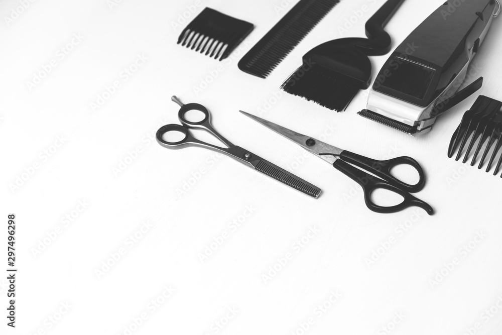 Hairdressing tools in black and white on a white background with copy space on the right Hairdressing tools in black and white on a white background with copy space on the right