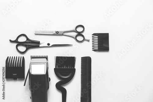 Hairdressing tools in black and white on a white background with copy space on the right