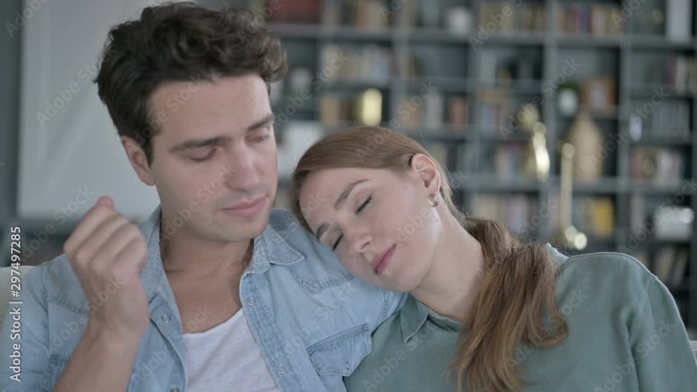 Beautiful Woman sleeping on Shoulder of Man Lovingly Beautiful Woman sleeping on Shoulder of Man Lovingly