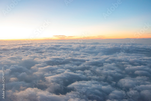 Flying over the vast clouds in the morning.