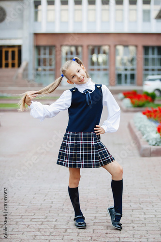 Photography Cute teenager schoolgirl in uniform.