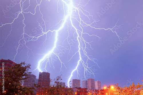 Lightning thunderstorm over the city at night sky