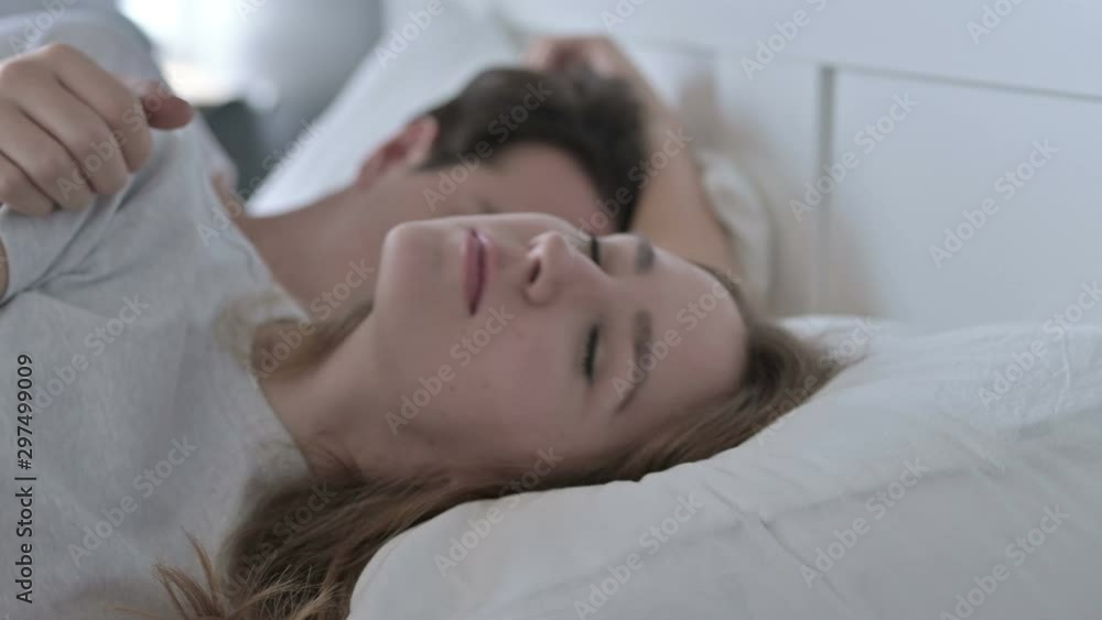 Attractive Couple Sleeping in Bed Peacefully Attractive Couple Sleeping in Bed Peacefully