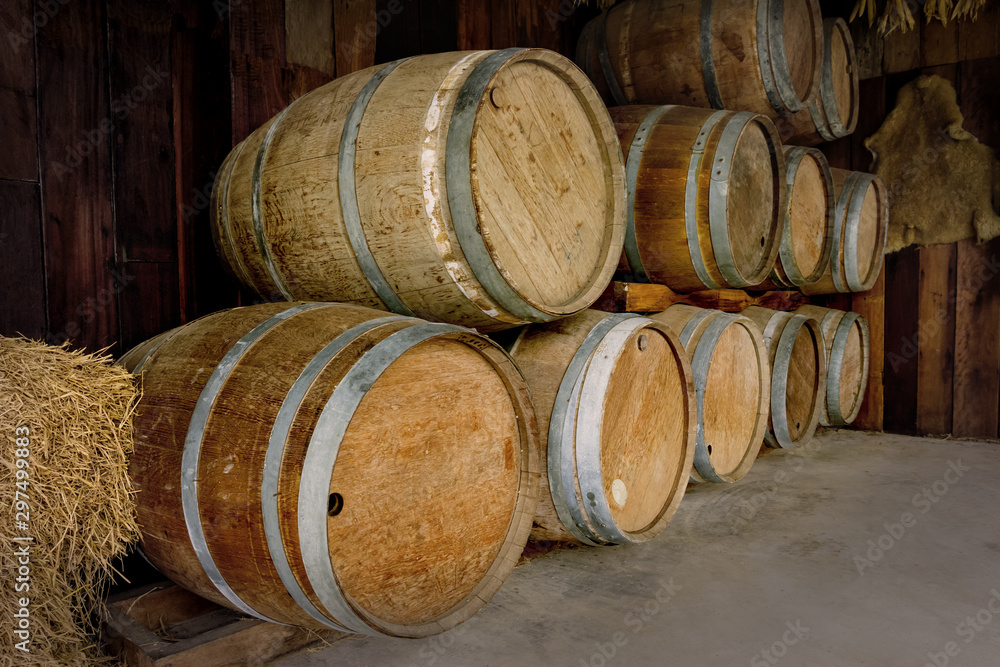 old wooden barrels stacked in winery