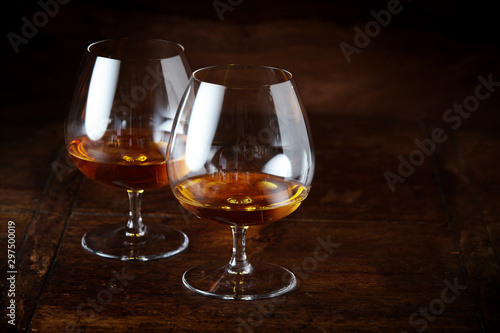 Two cognac snifter glasses with copy space