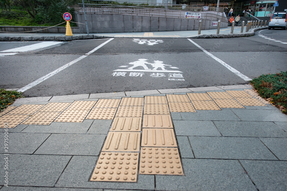 Braille Blocks in the pedestrian guiding the blinds walks. Also
