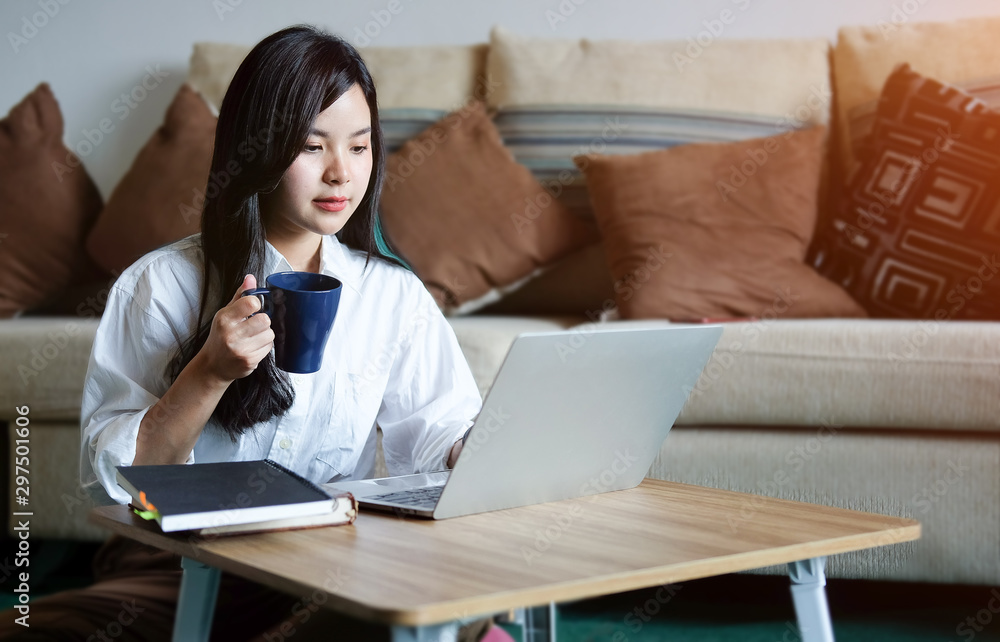 Business working in home living room enjoying sunny morning on the day with documents and laptop people Consulting and business planning. 