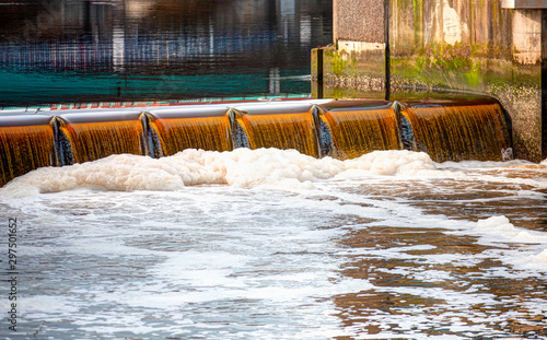 Fotografi Pollution in the river or canal with foam