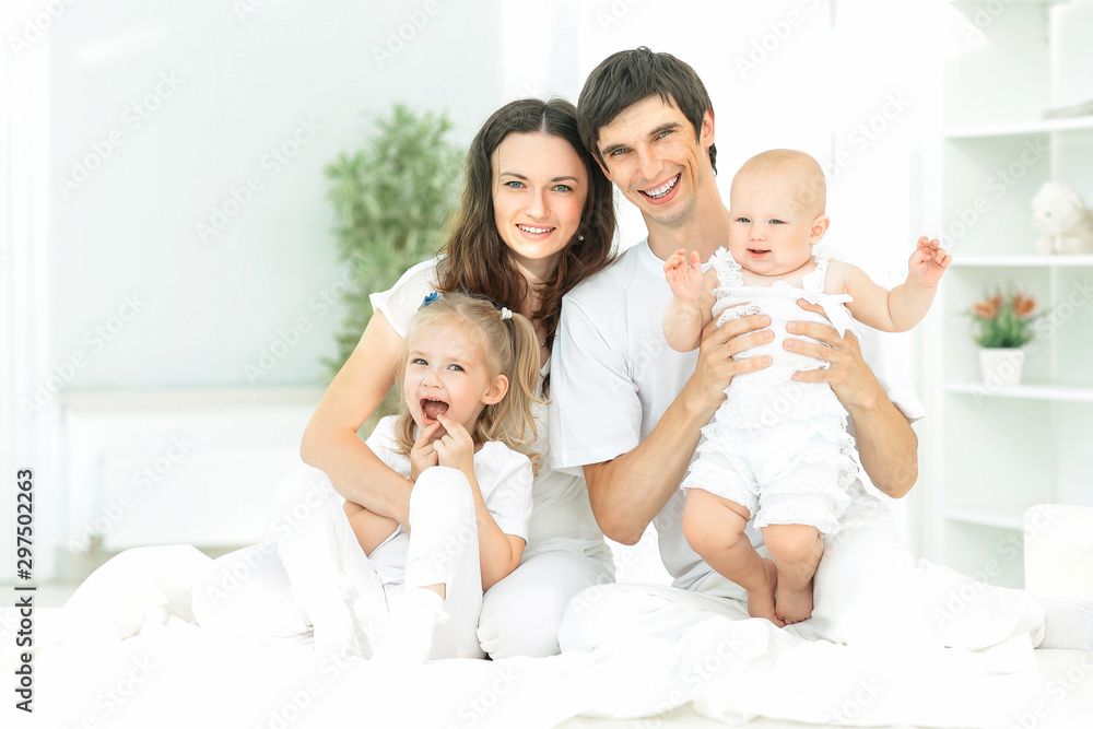 modern happy family on a Sunday in the nursery