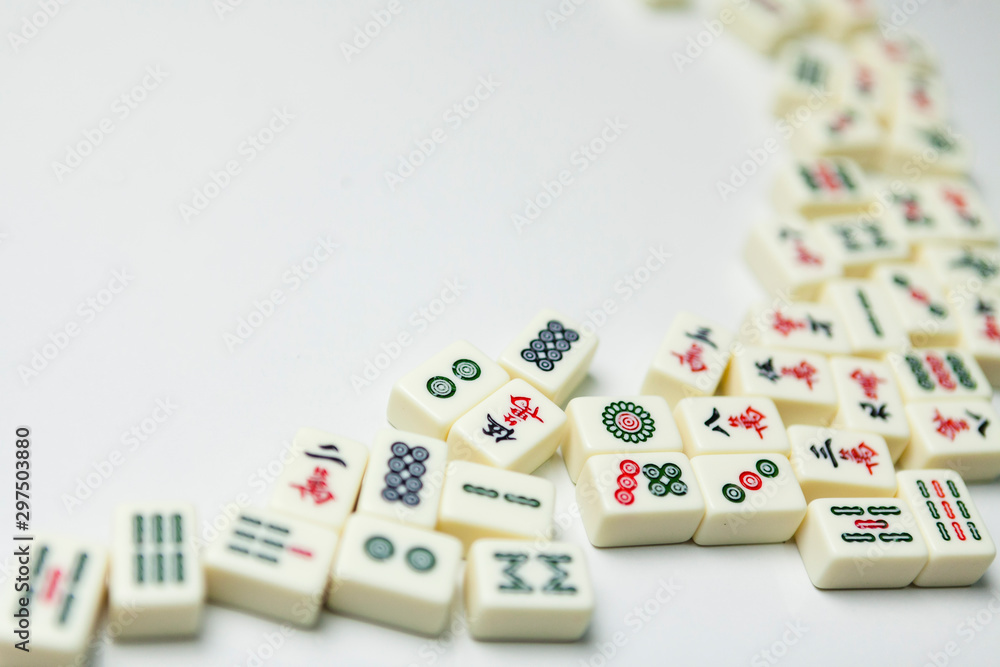 Pile of Mahjong ancient asian game on the white background Pile of Mahjong ancient asian game on the white background