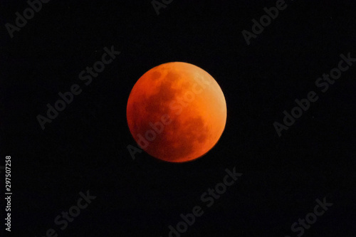 Fototapeta Naklejka Na Ścianę i Meble -  Super blue blood moon January 2018 lunar eclipse, real time taken in Kanchanaburi west Thailand. (photo contain noise a bit)