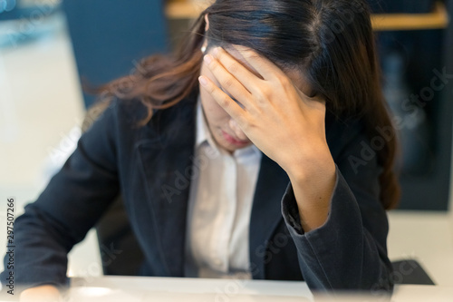 Picture of asian business woman headache stressed because of work mistake problems , Confused business woman with stressed and worried about working mistake and problems