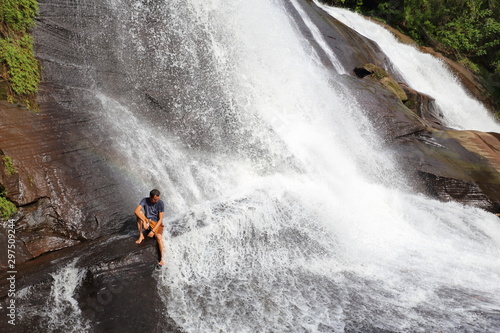 Man and Chet Si waterfall at Bueng Kan Province,Thailand