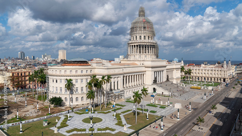 National Capitol Building in havana with the great theatre an the sea in the background on a sunny cloudy day, cuba © André Gerken