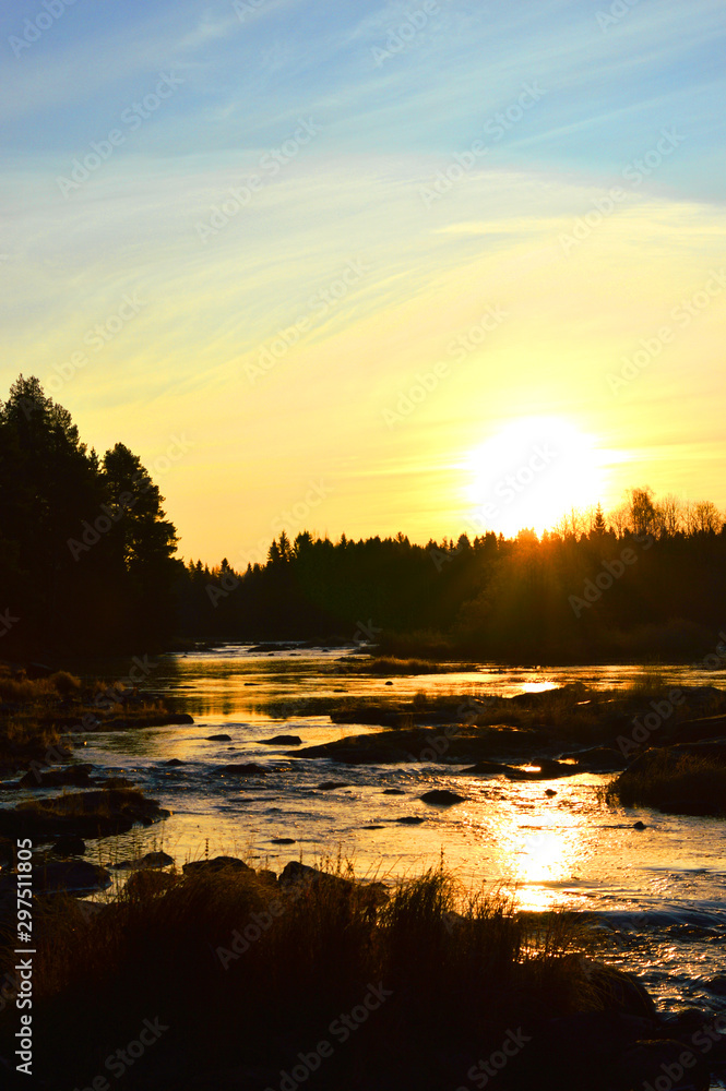 Autumn morning in Koiteli rapid, Kiiminki river. Sunset, light of dawn. Beautiful sky, flowing water. Koitelinkoski, Kiiminkijoki. 