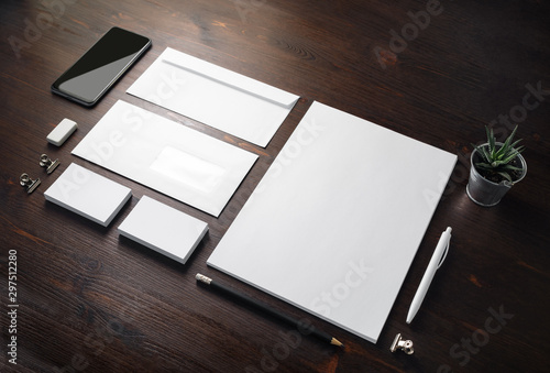 Photo of blank stationery set on wood table background. Corporate identity template. Responsive design mockup.