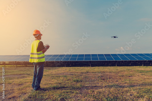 Inspector engineering concept; Engineer inspect and checking solar panel by Drone at solar power plant