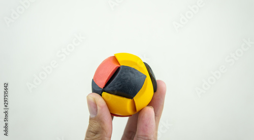 Colorful rubber puzzle ball isolated on white background.