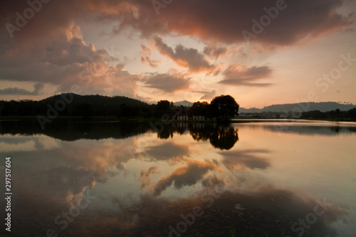 Sunrise at a lake in Jitra Kedah Malaysia with floating plant  photo