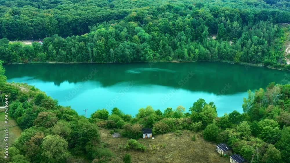 Beautiful aerial view of a small lake and water reflection. Beautiful aerial view of a small lake and water reflection.