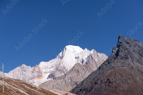 Beautiful snow mountain peak with clear blue sky in Yading natural reserve Nature landscape