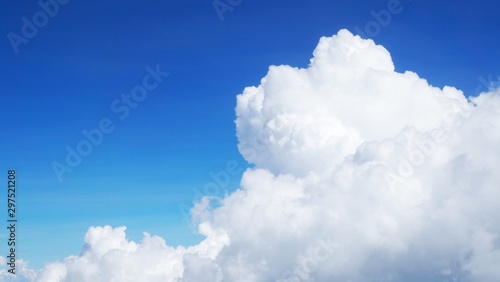 blue sky background with clouds, beautiful cloudscape, view over white fluffy clouds, freedom concept