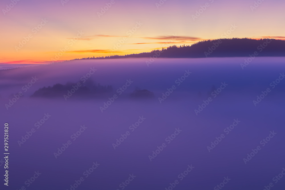 Detail of nice autumn misty fog and hill in sunrise, Czech landscape