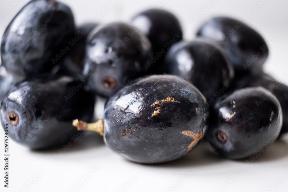 Big black spanish grapes over a white background Big black spanish grapes over a white background