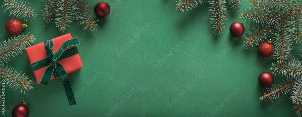 Christmas border with xmas tree and red gift on green background. Merry  christmas card. Winter holiday. Happy New Year. Space for text Stock Photo  | Adobe Stock