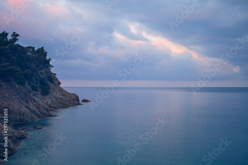 Rocky coast by the sea. Sky in the clouds © Berg