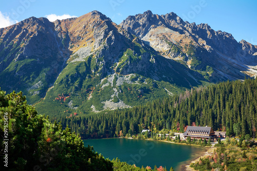 Fototapeta Naklejka Na Ścianę i Meble -  Poprad Lake with autumn forests  from the hiking trail of the Ostrva mountain in High Tatras National Park, Slovakia