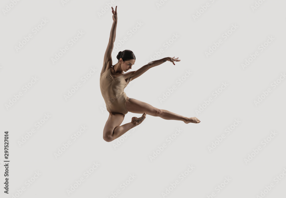 Modern ballet dancer. Contemporary art ballet. Young flexible athletic woman.. Studio shot isolated on white background. Negative space. - obrazy, fototapety, plakaty 