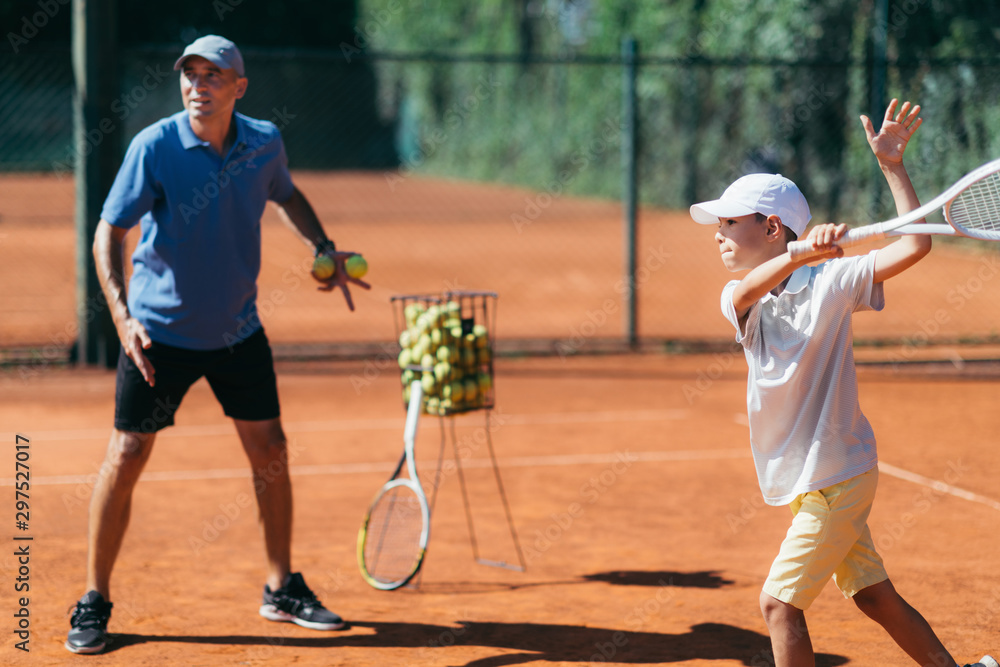 Tennis Lesson with Boy and Trainer