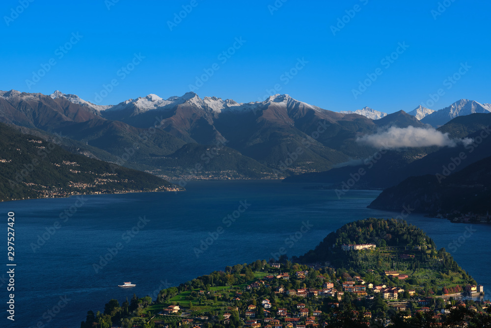 Alps in the snow Lake Como Italy. Clear blue sky Top view of the city of Bellagio