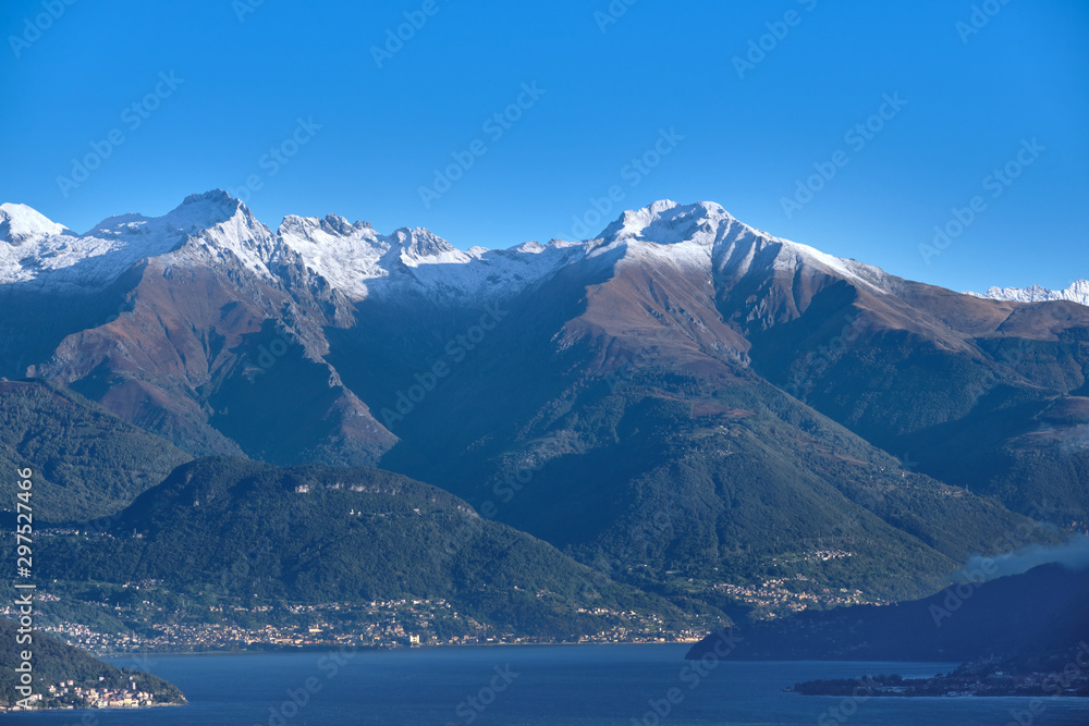 Alps in the snow Lake Como Italy. Clear blue sky