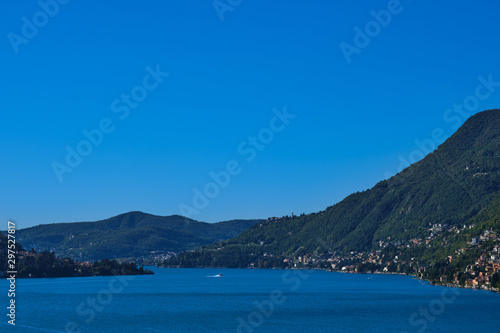 Panoramic view of Lake Como. Lombardy, Italy. Autumn season. Perfect clear blue sky.