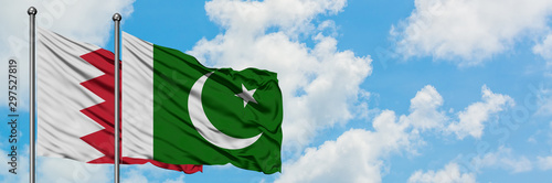 Wallpaper Mural Bahrain and Pakistan flag waving in the wind against white cloudy blue sky together. Diplomacy concept, international relations. Torontodigital.ca