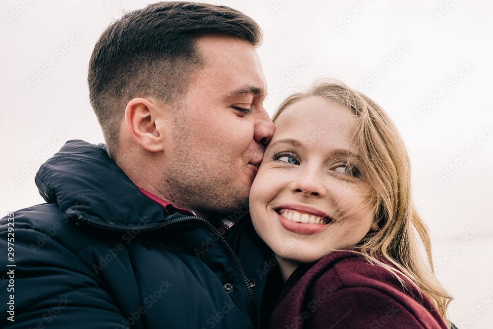 couple hugging on a pier couple hugging on a pier