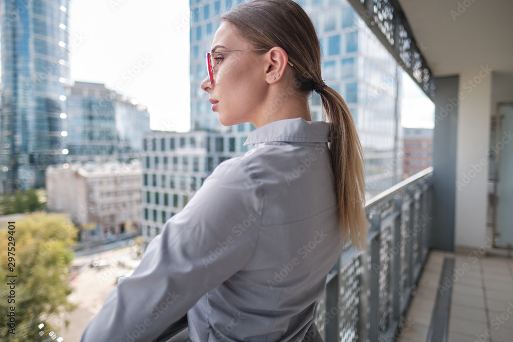 Beautiful business woman on the background of the modern office Beautiful business woman on the background of the modern office