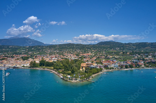 Aerial photography. Beautiful coastline. In the city of Bardolino  Lake Garda is the north of Italy. View by Drone.