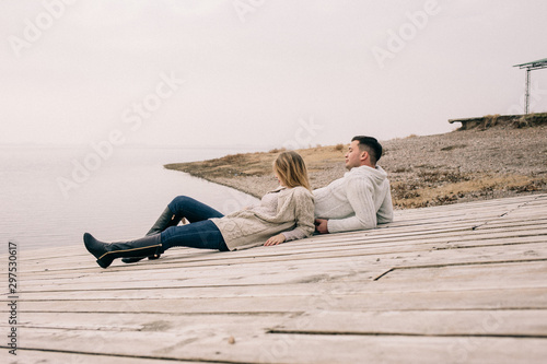 couple hugging on a pier