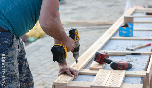 Worker on construction site with tools