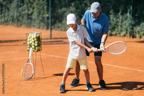 Boy Learning to Play Tennis © Microgen