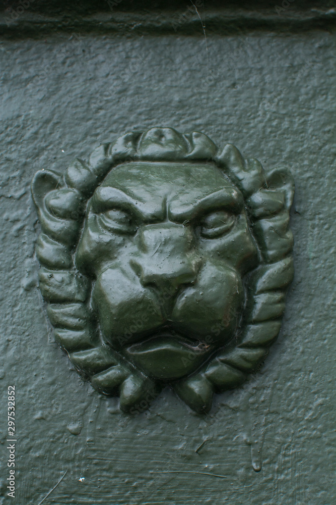 Mask of a lion on a pillar on the bridge, St. Petersburg, Russia