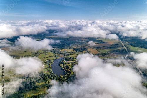 Beautiful views of the countryside from a great height. Flying above the clouds.